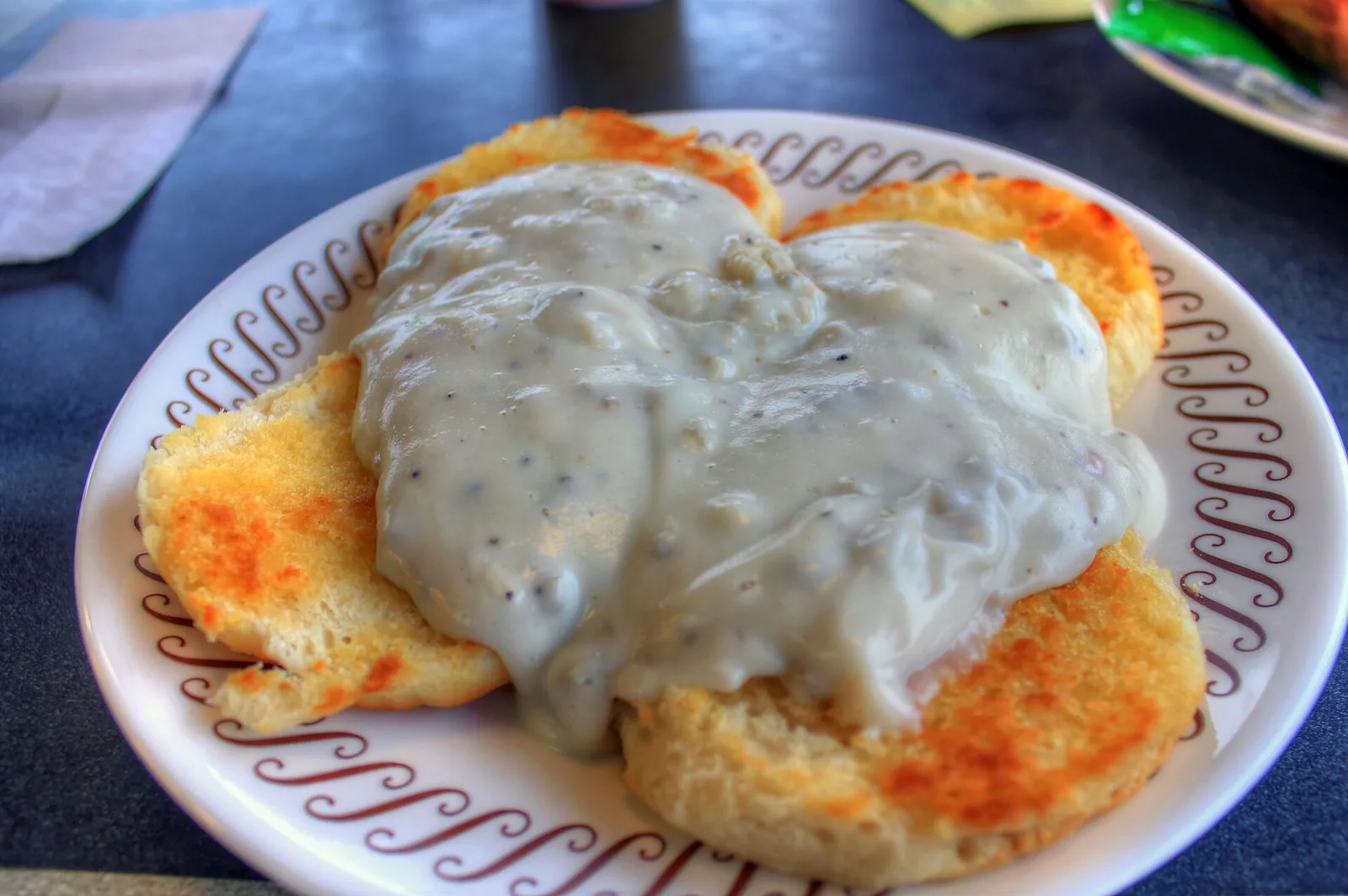 Biscuits and sausage gravy on a diner plate. The photo was not taken in Knoxville.