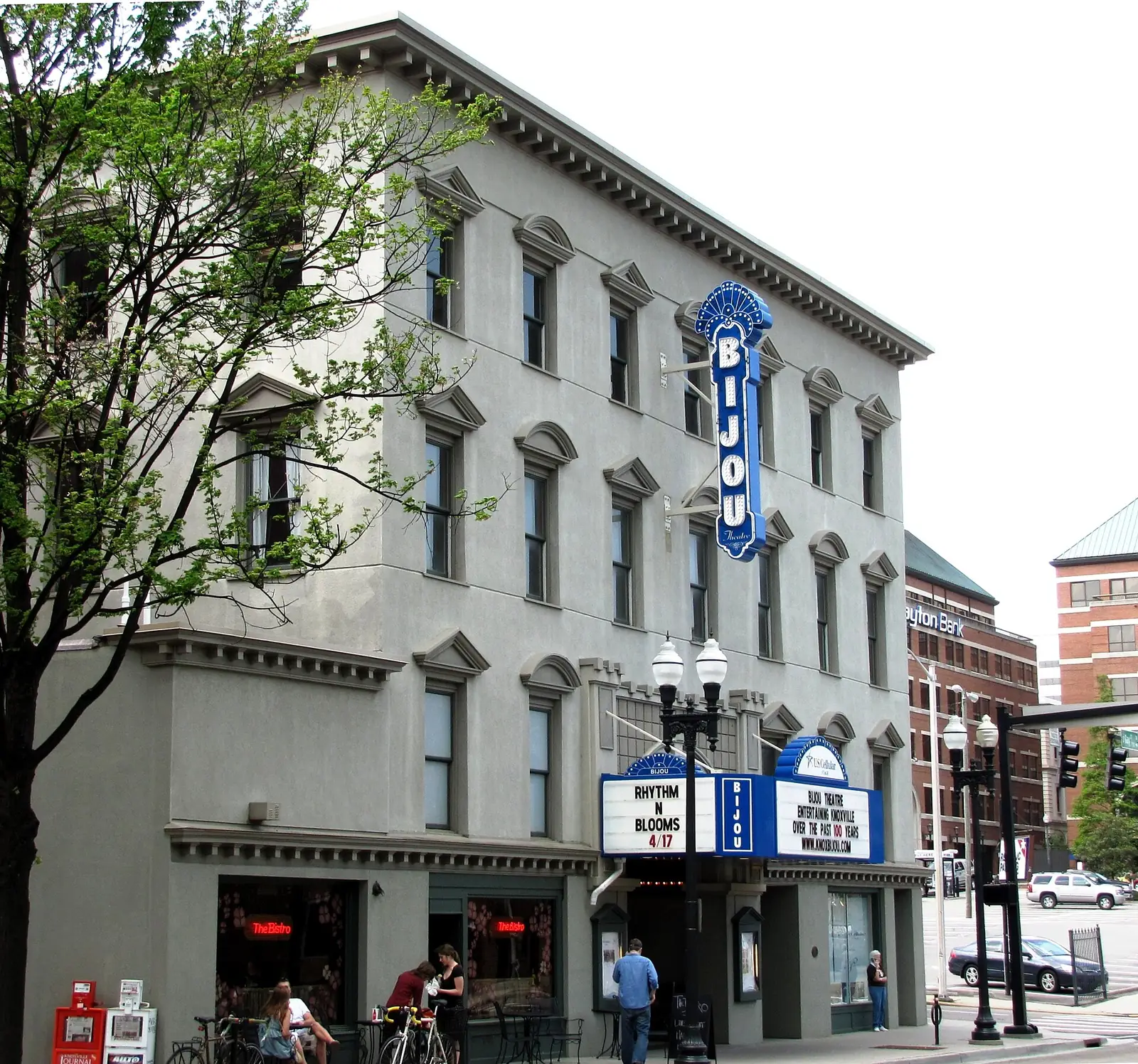 The Bijou Theatre's blue sign and marquee on South Gay Street in downtown Knoxville, with the Bistro at the Bijou on the corner.