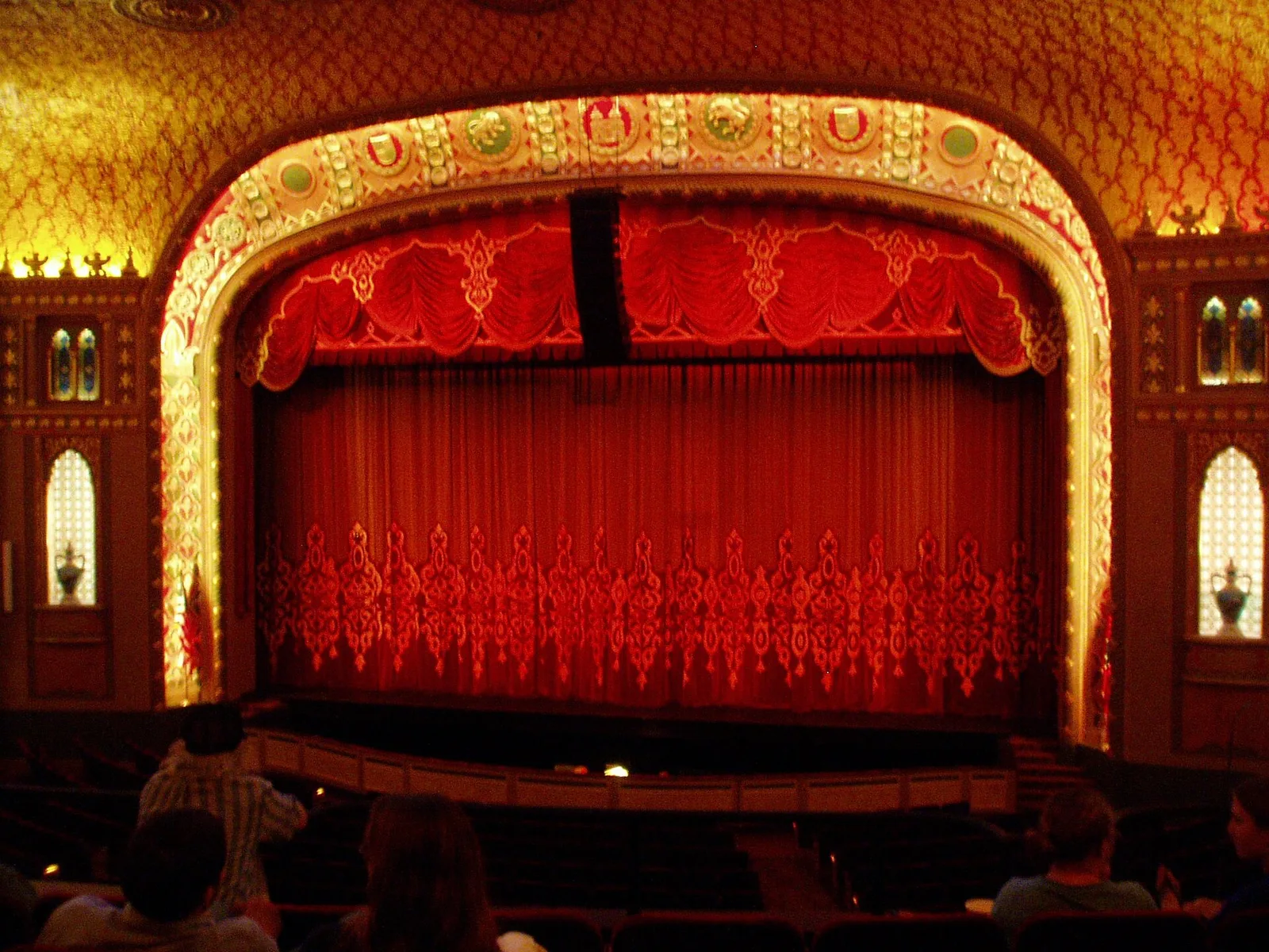 The stage, red curtain and gilded proscenium arch inside the Tennessee Theatre on South Gay Street in downtown Knoxville.