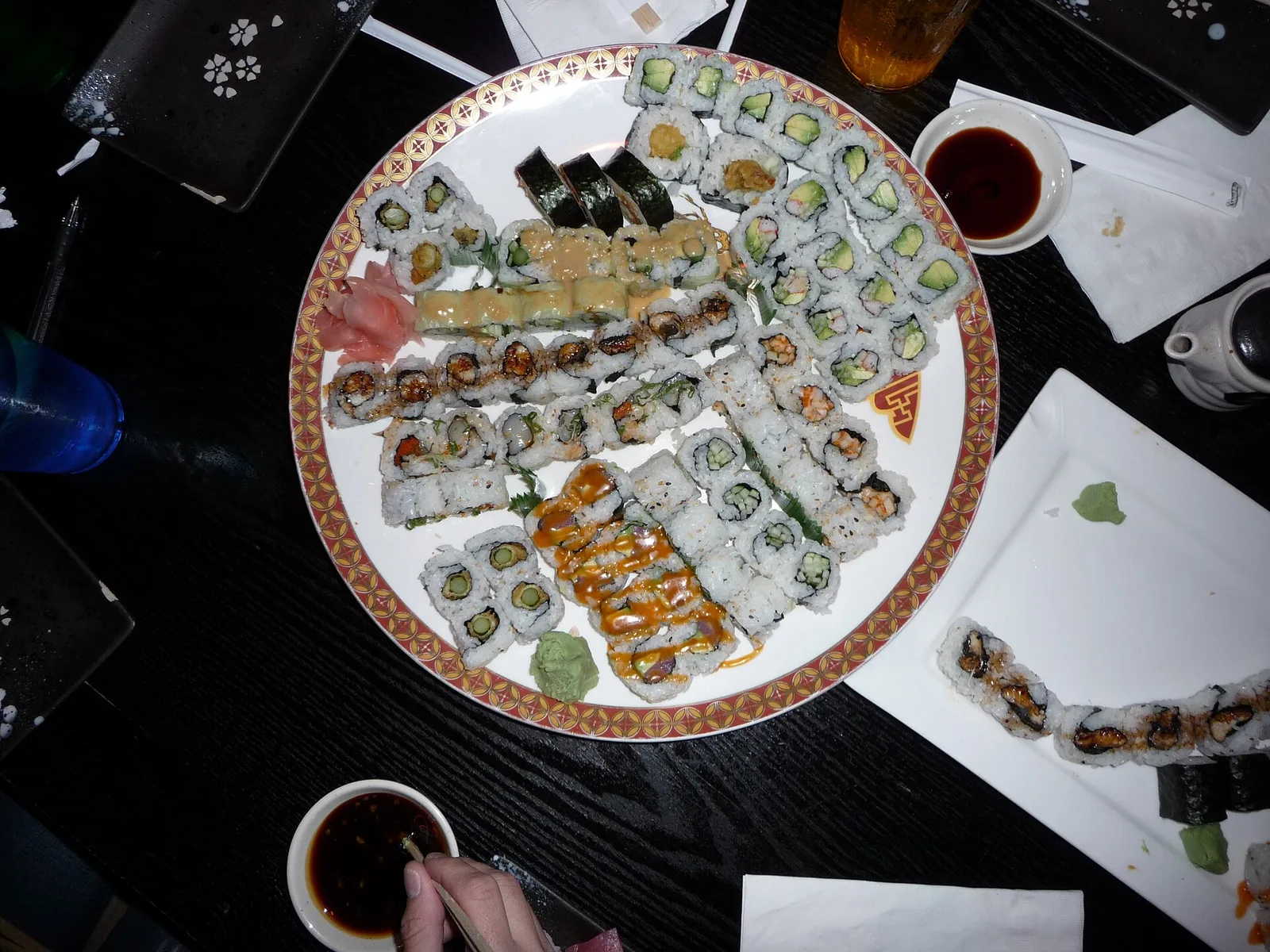 A platter of maki rolls with ginger, wasabi and soy sauce. The photo was not taken in Knoxville.